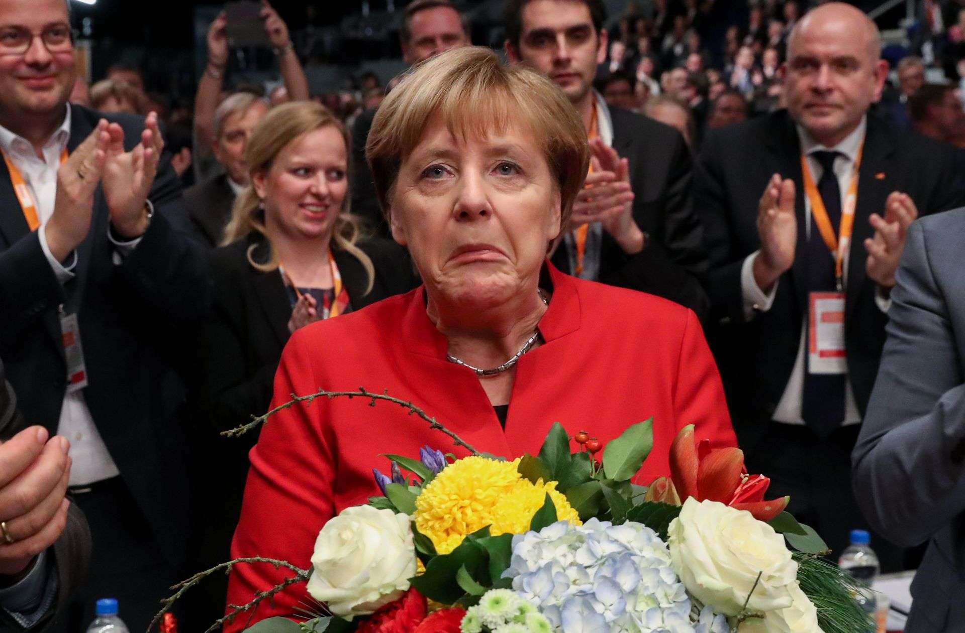 Angela Merkel receiving flowers