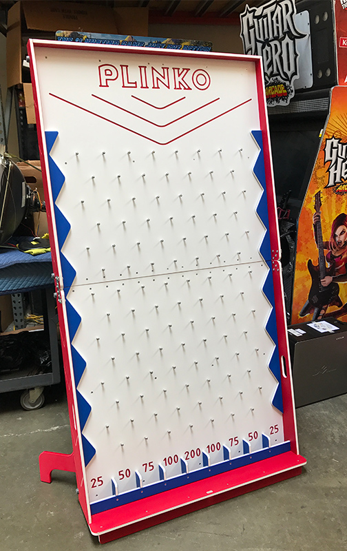 A large plinko game pin board.