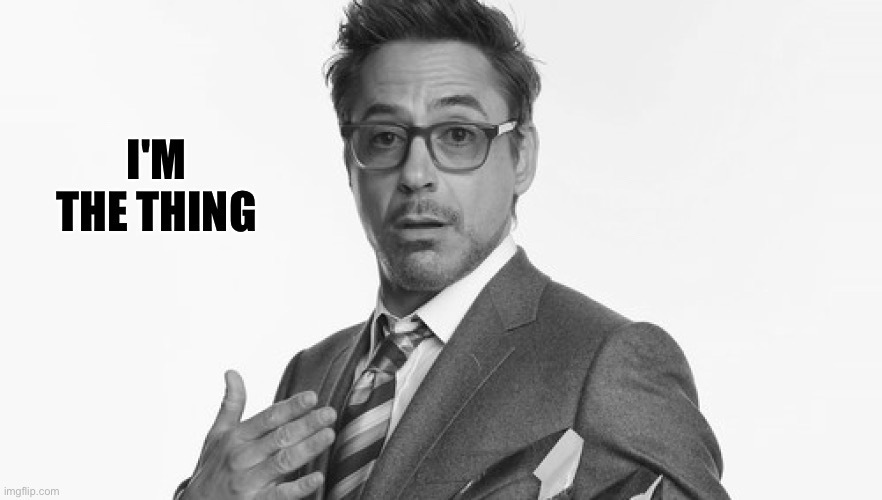 A black and white picture of Robert Downey Jr. with the caption "I'm the thing"
