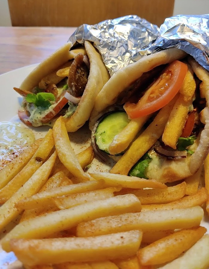 Close-up picture of vegan greek gyros and french fries