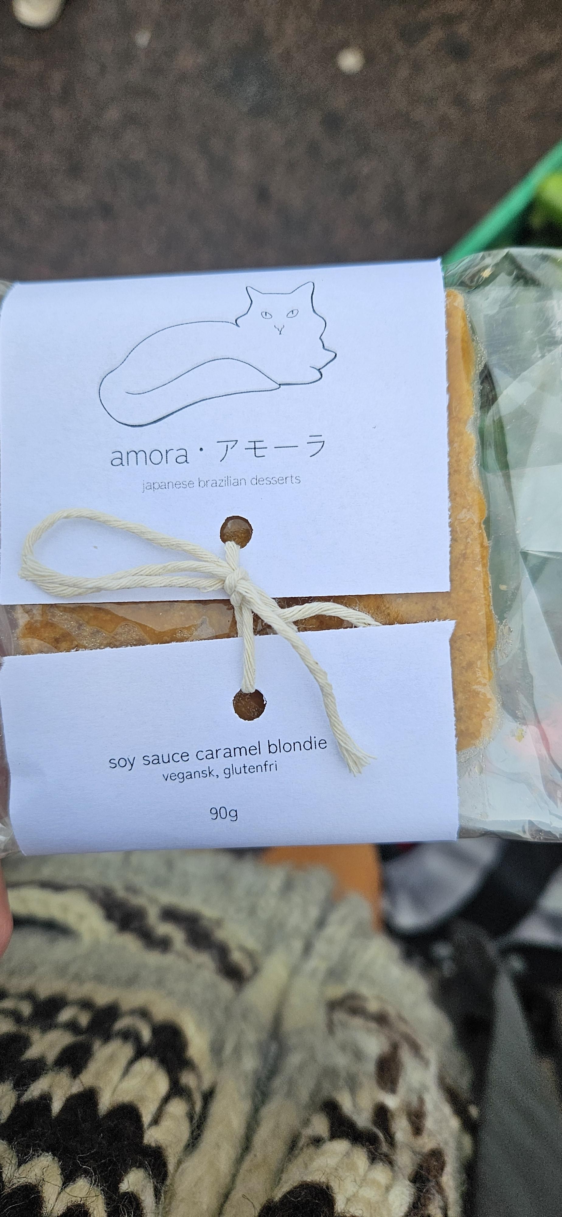 Packaged vegan soy sauce caramel blondie with a cat logo