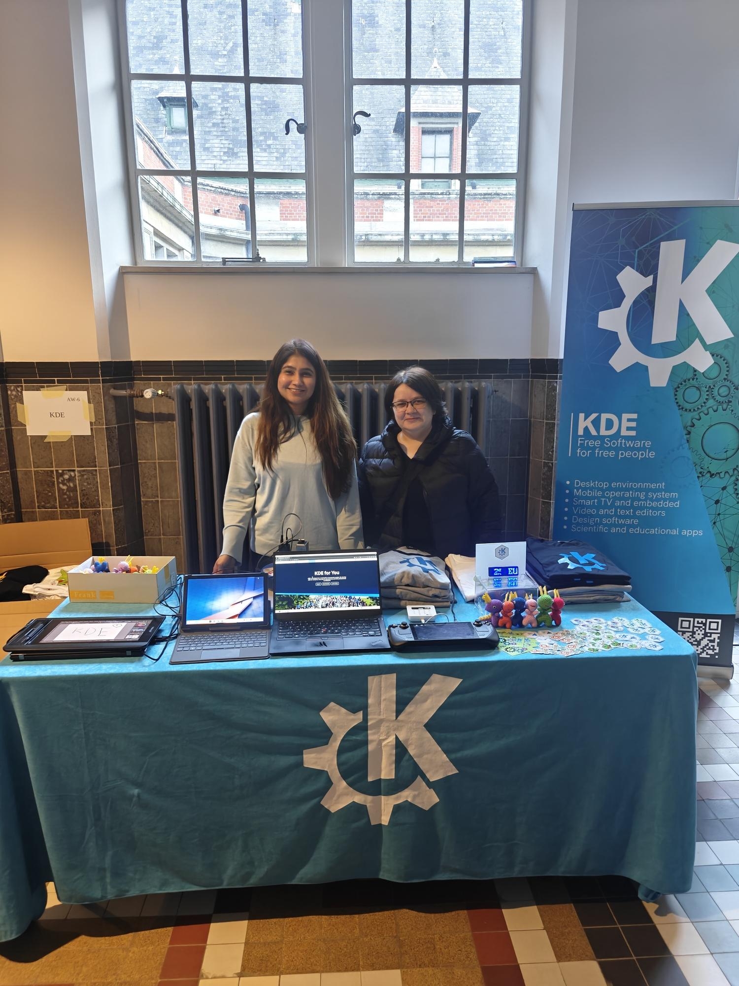 Aniqa and Lydia at the KDE booth during FOSDEM 2025.