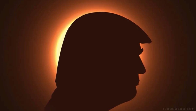 Trump posts bizarre solar eclipse ad – with his head plunging US into darkness